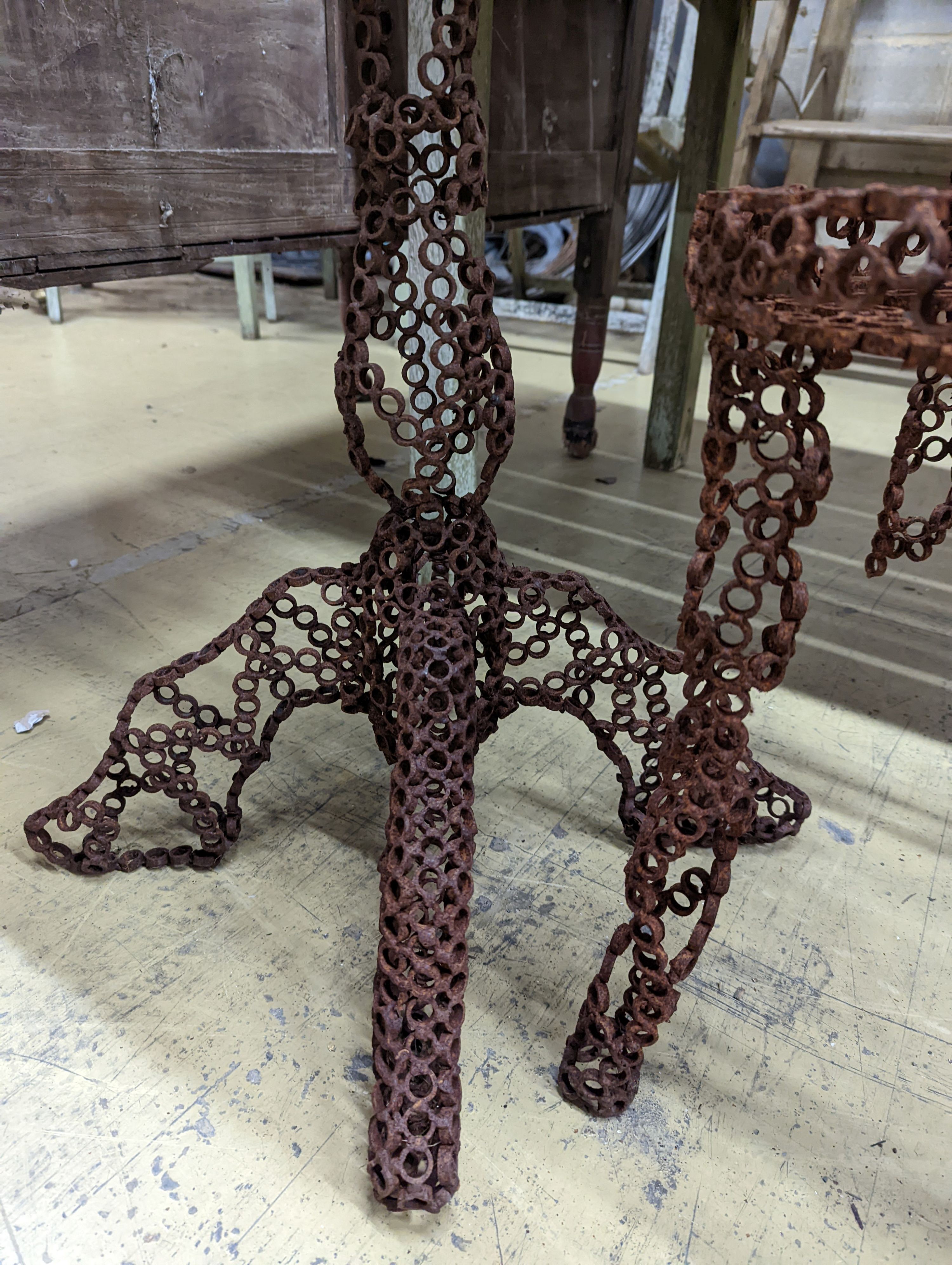 A reclaimed metal table and chair (chair a.f.) table measurements, D-54cm, H-66cm.